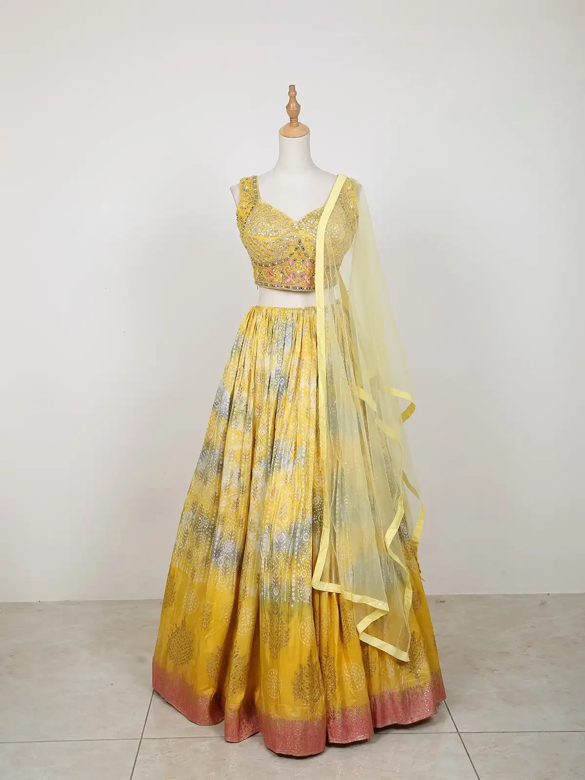 Yellow Lehenga Adorned with Tie and Dye Design with Embroidered Top and Dupatta