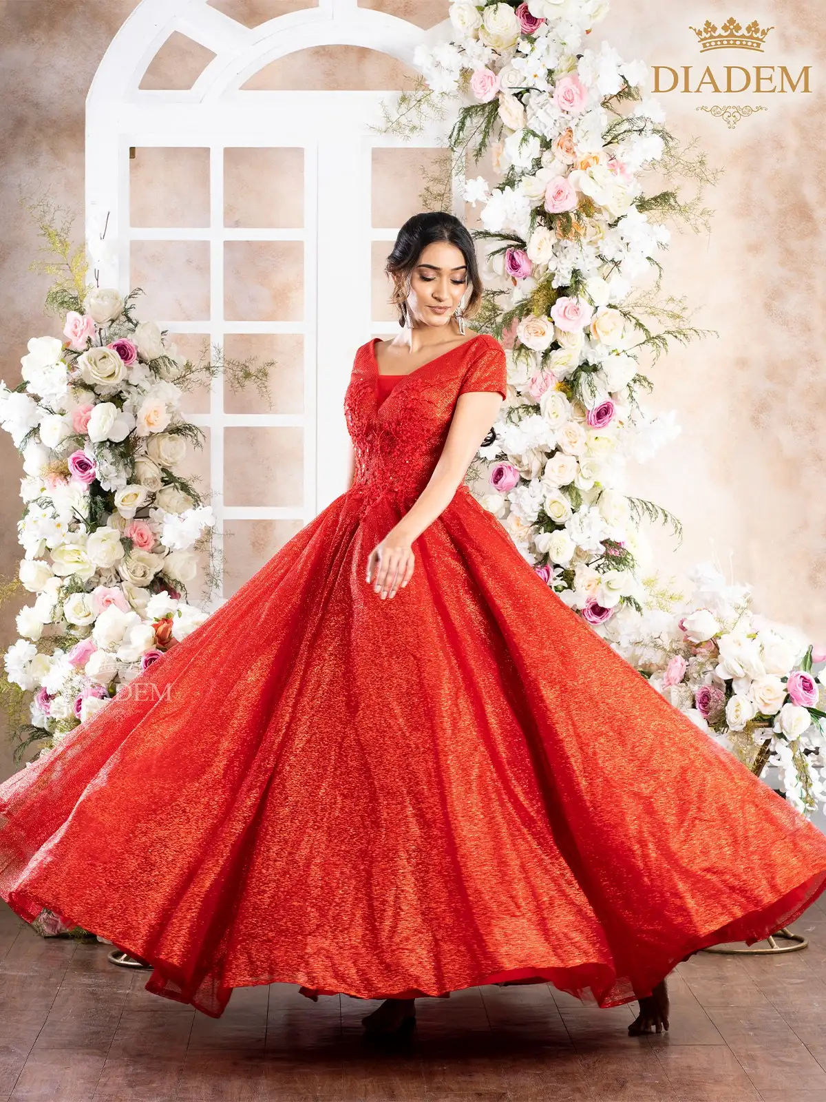 Red Net Ball Gown Embellished With Shimmers And Floral Laces