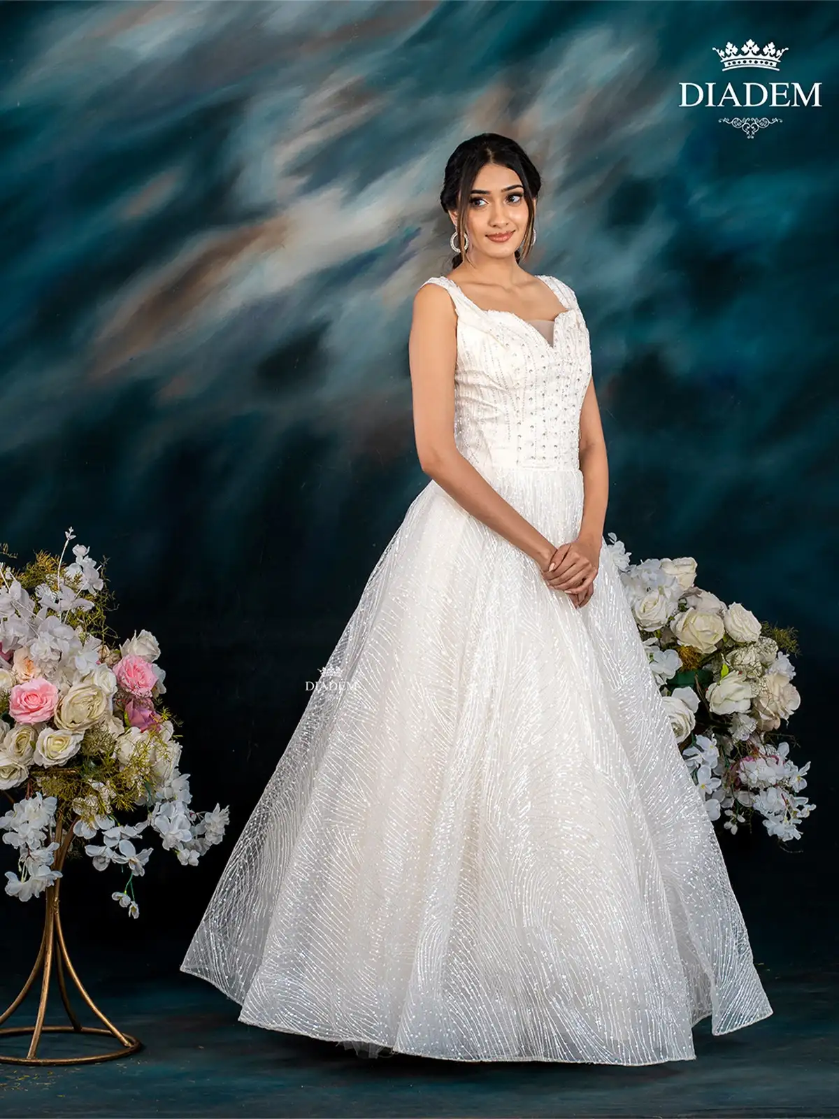 White Net Gown Embellished with Sequins and Thread work