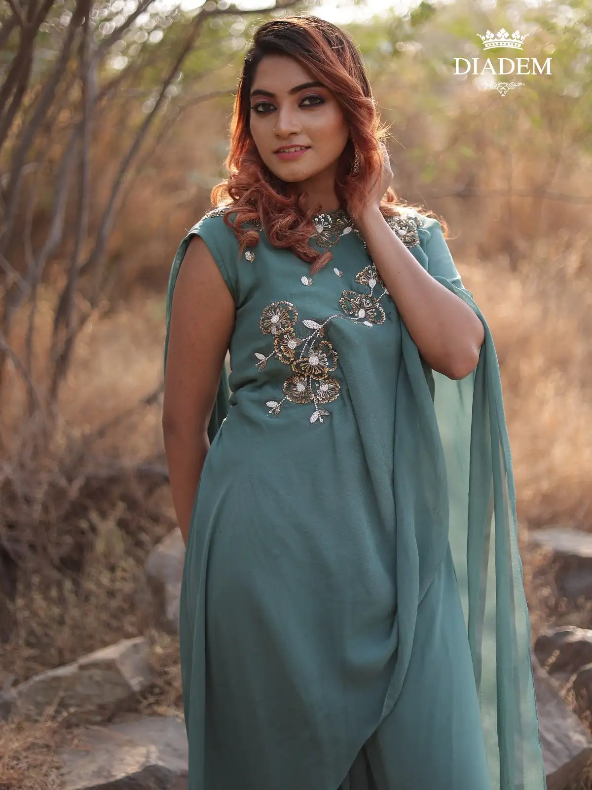 Teal Green Gown Adorned With Beads And Stones