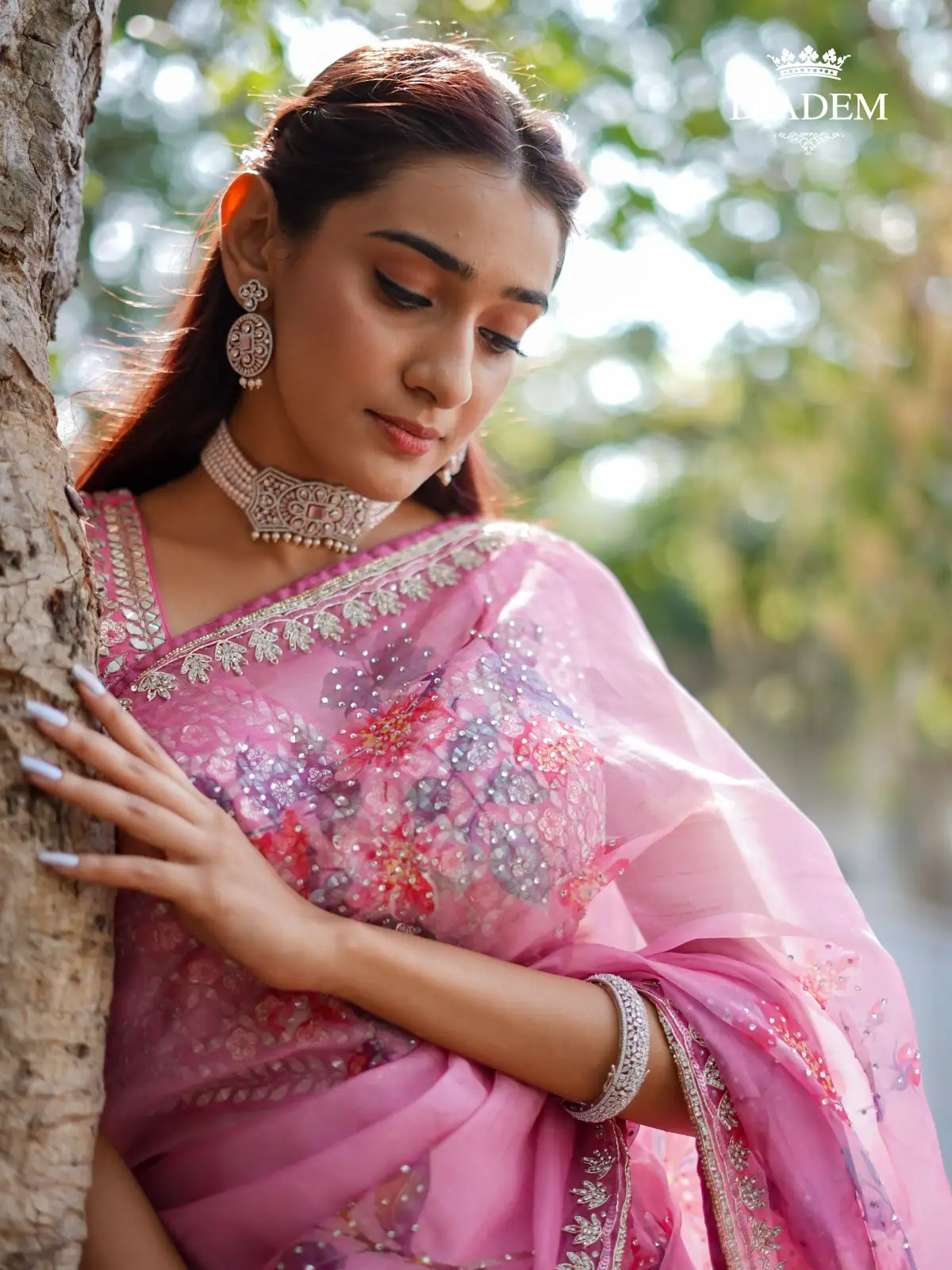 Pink Semi Organza Saree Adorned With Floral Prints And Embroidered Border