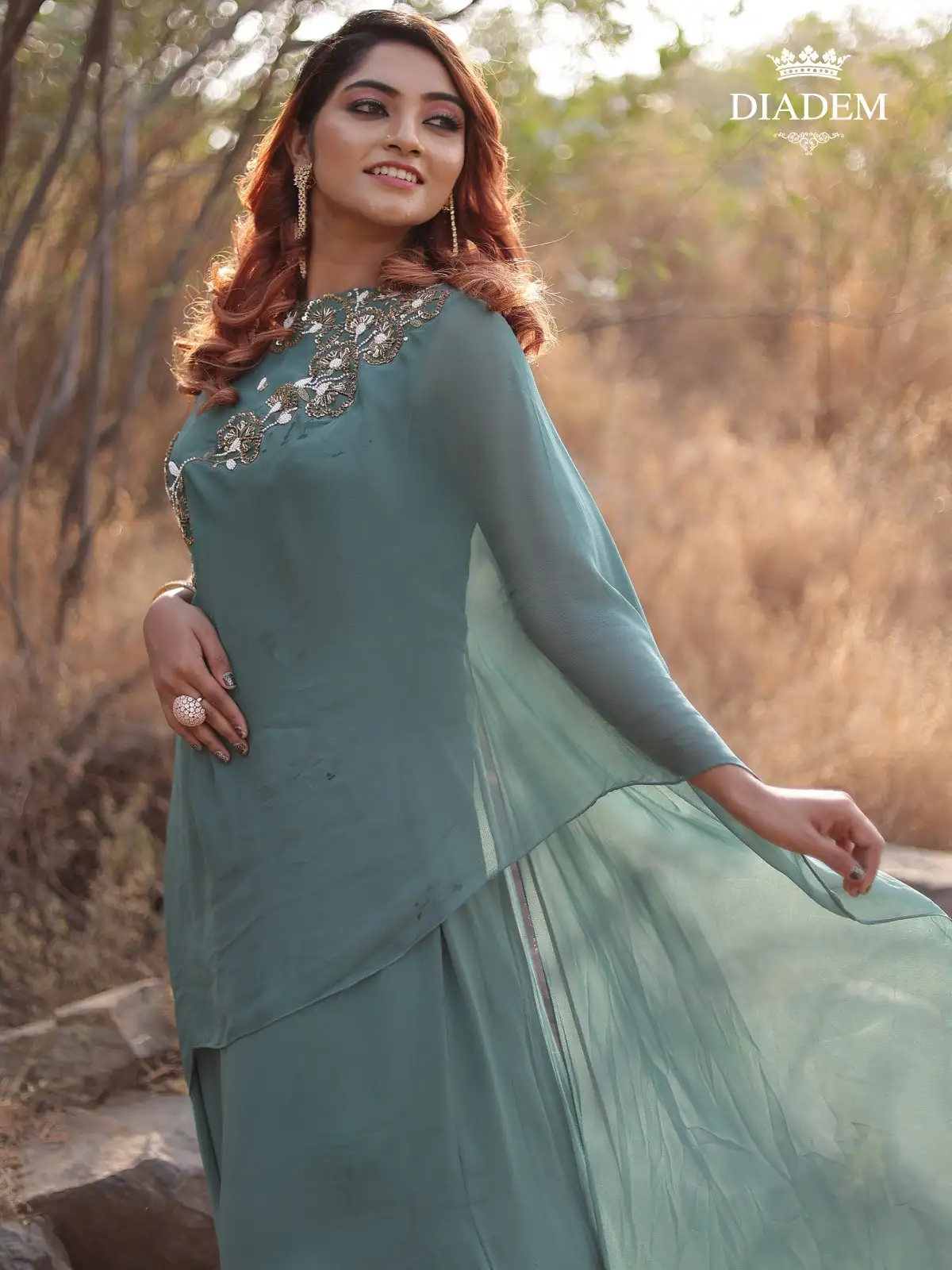 Teal Green Gown Adorned With Beads And Stones