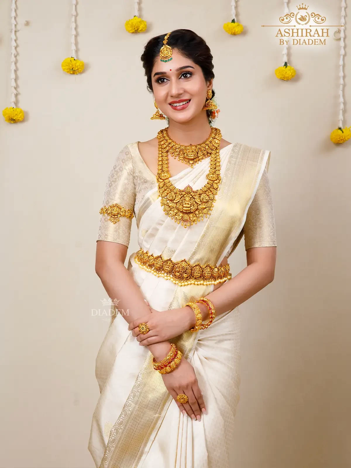 Ivory Pure Kanchipuram Silk Saree With Paisley Motifs On The Body And Gold Zari Border