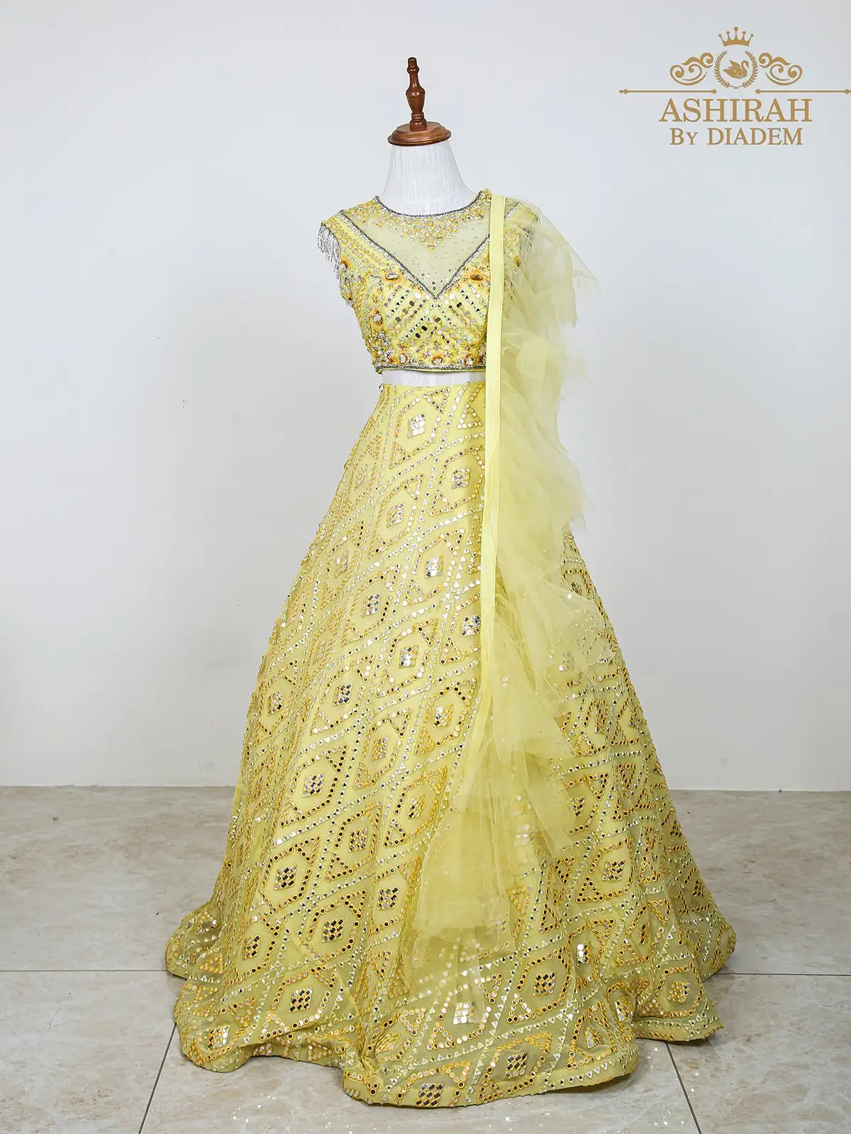 Light Yellow Net Lehenga Embellished with Foil and Thread Work along with Ruffle Dupatta