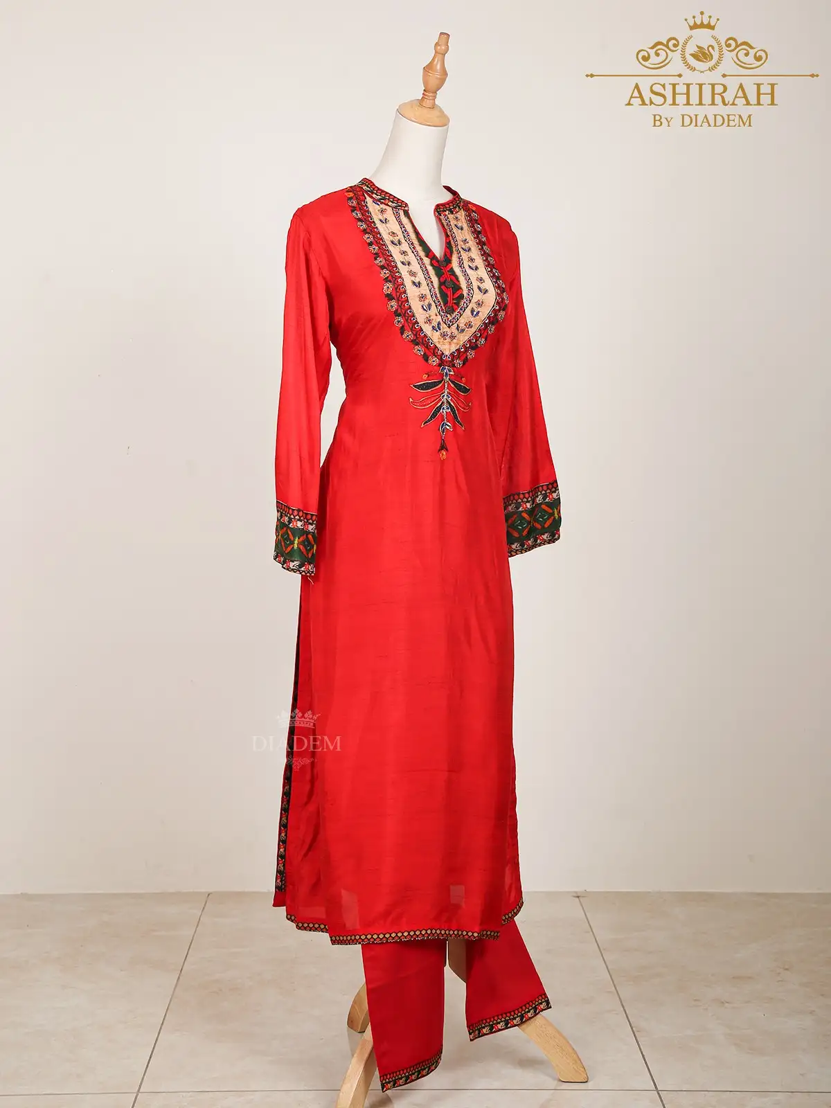 Red Straight Cut Suit Enhanced In Floral Prints And Beads