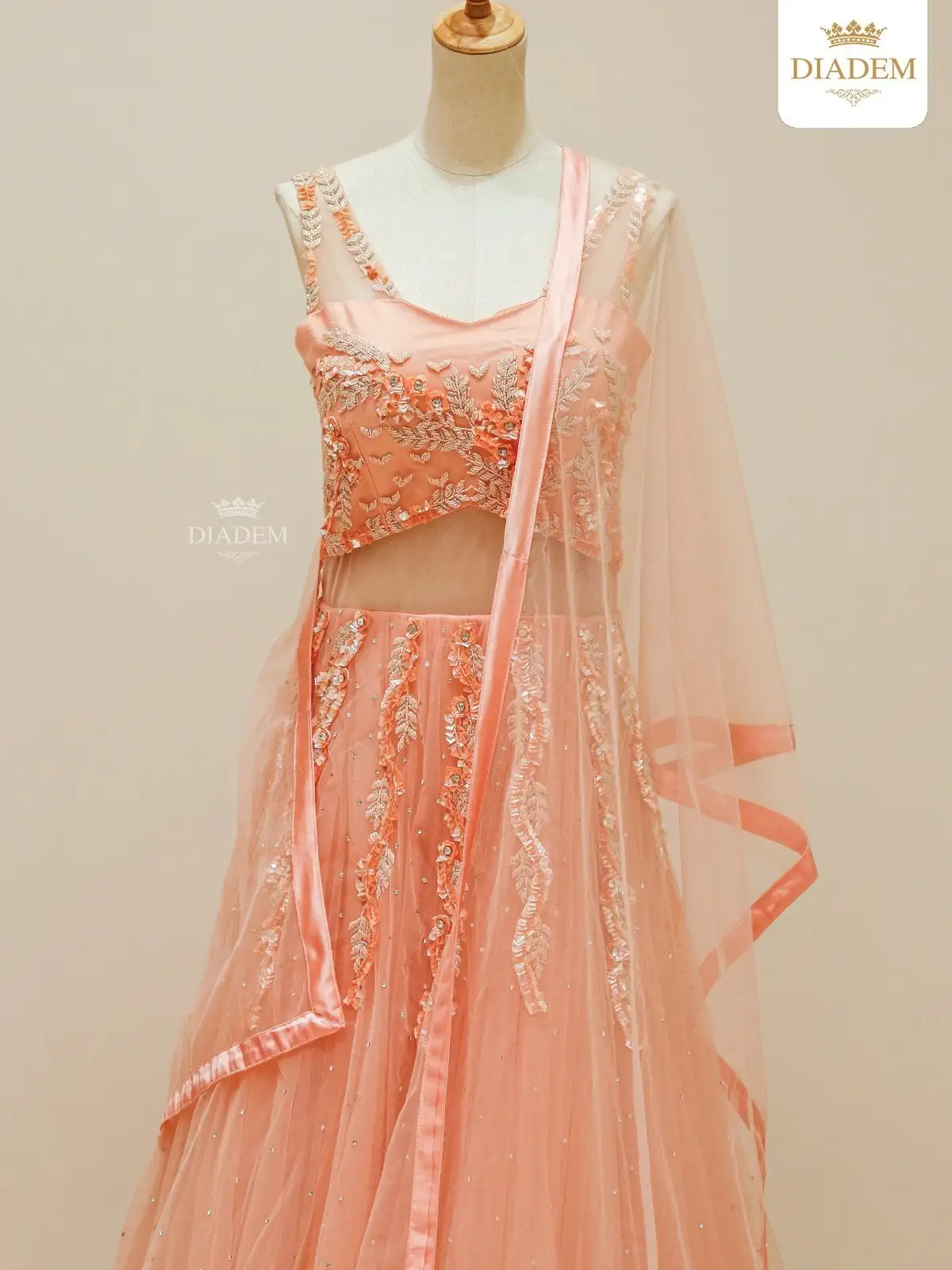 Light Peach Net Gown Adorned With Floral Embroideries And Dupatta