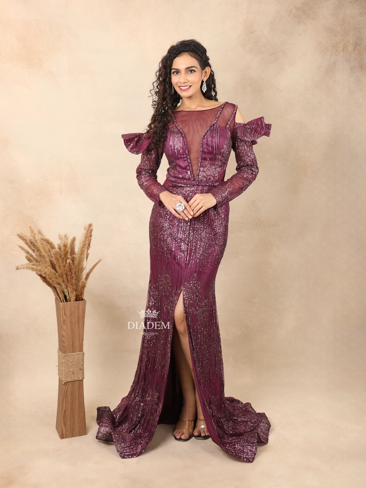 Burgundy Net Slit Gown Adorned With Glitter And Beads