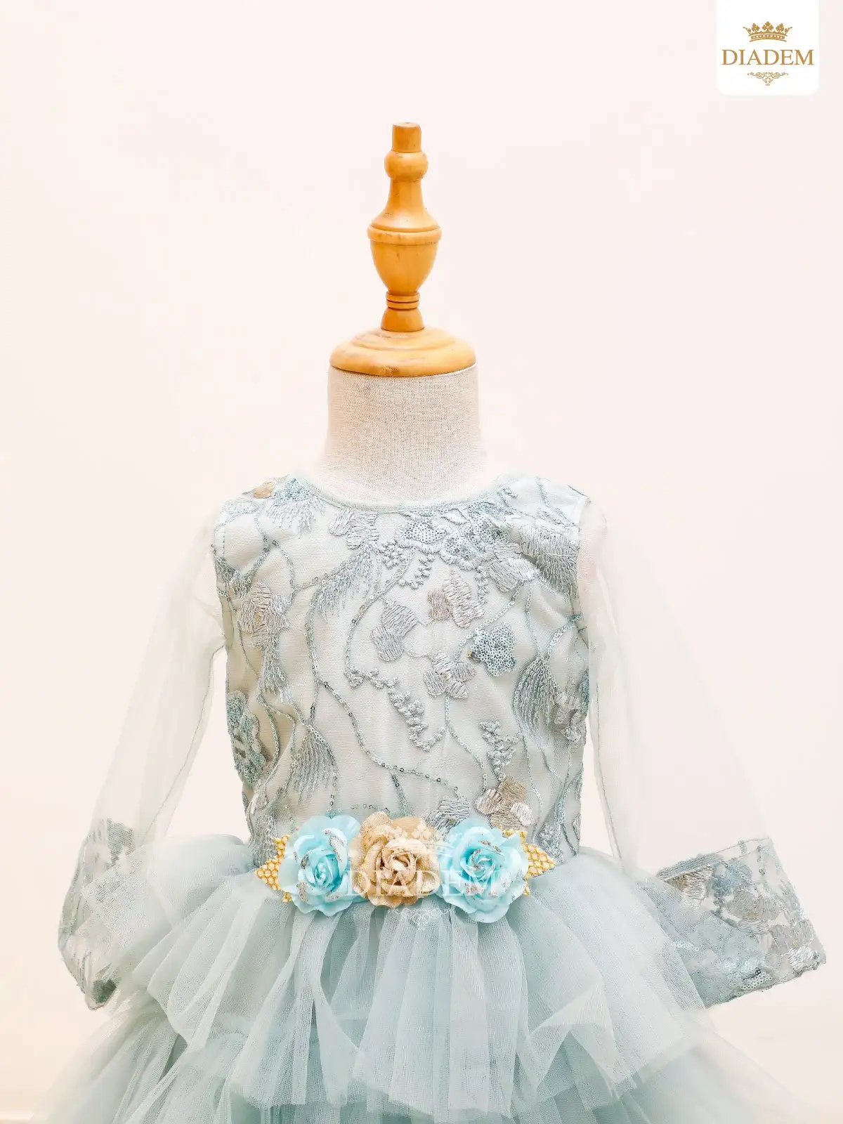 Light Blue Net Gown Embellished With Sequins And Floral Buds