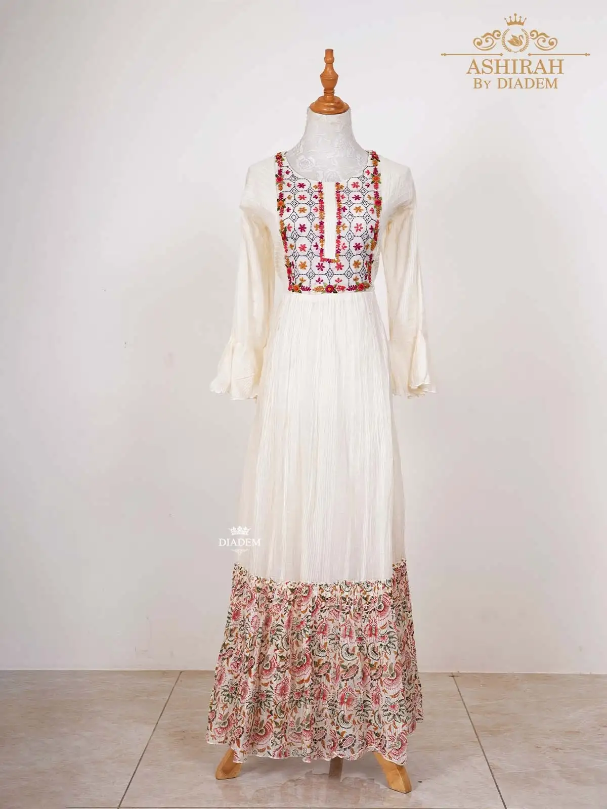 Off White Long Kurti Adorned In Floral Embroideries