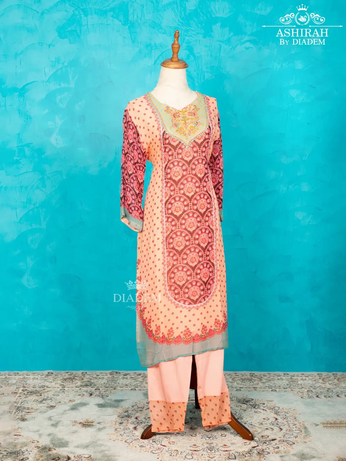 Light Pink Straight Cut Suit Enhanced With Floral Prints