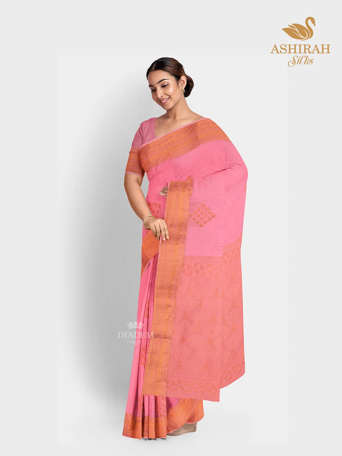 Pink Silk Cotton Saree with Zari Butta on the body and Copper Zari Border